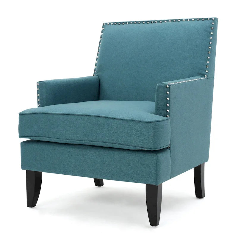 Fauteuil club en tissu clouté