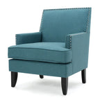 Fauteuil club en tissu clouté