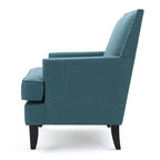 Fauteuil club en tissu clouté