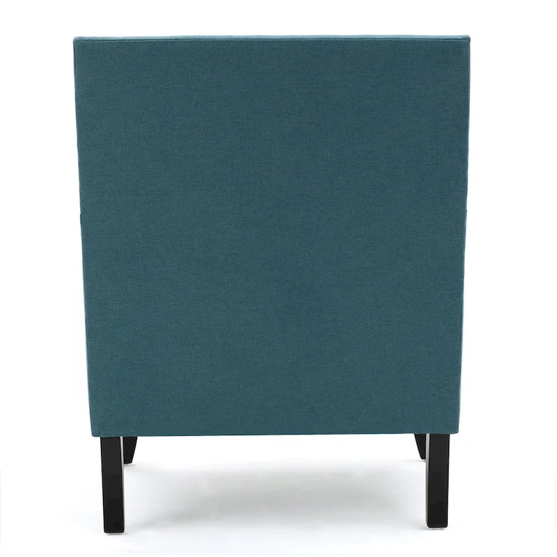 Fauteuil club en tissu clouté