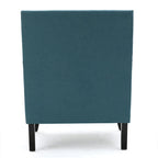 Fauteuil club en tissu clouté