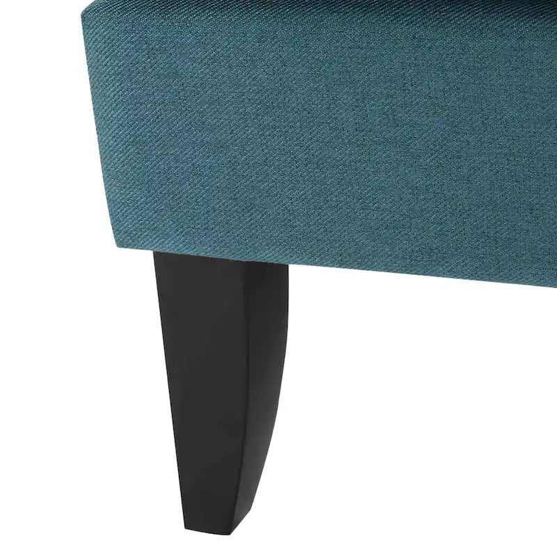 Fauteuil club en tissu clouté