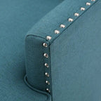 Fauteuil club en tissu clouté