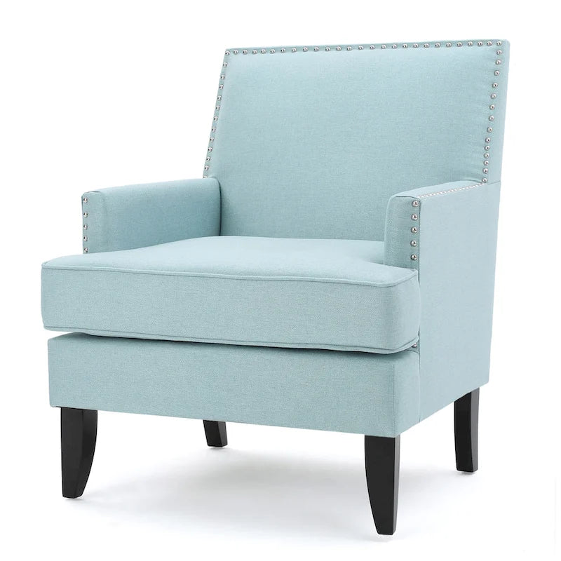 Fauteuil club en tissu clouté