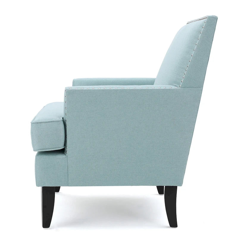Fauteuil club en tissu clouté