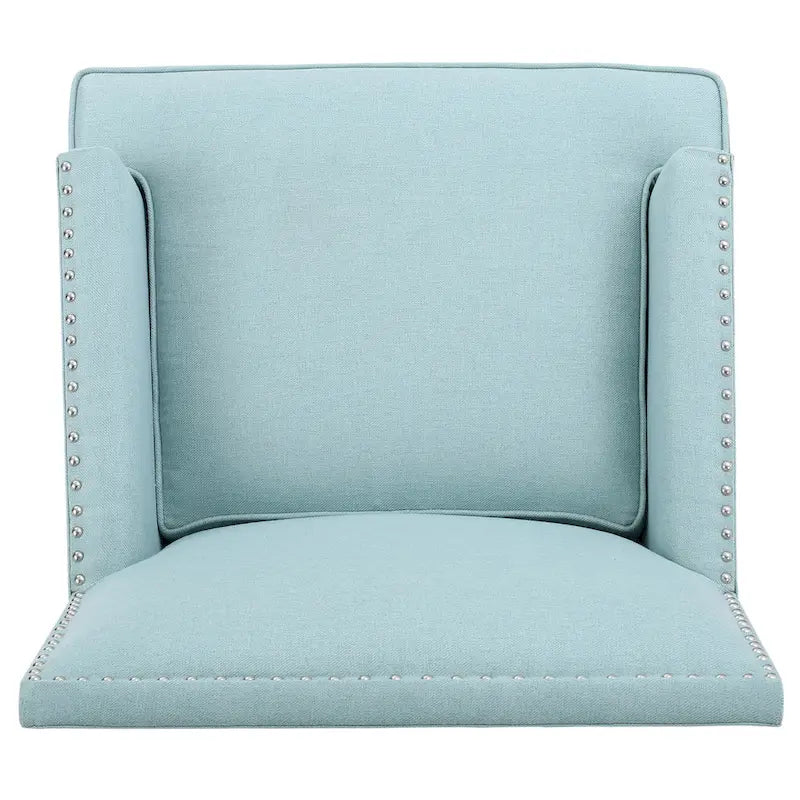 Fauteuil club en tissu clouté