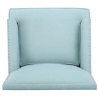 Fauteuil club en tissu clouté