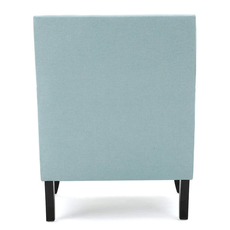 Fauteuil club en tissu clouté
