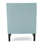 Fauteuil club en tissu clouté