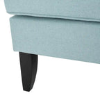 Fauteuil club en tissu clouté