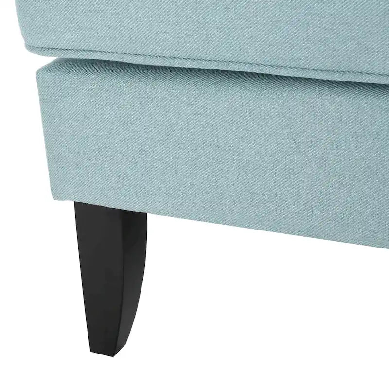 Fauteuil club en tissu clouté
