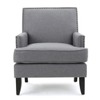 Fauteuil club en tissu clouté