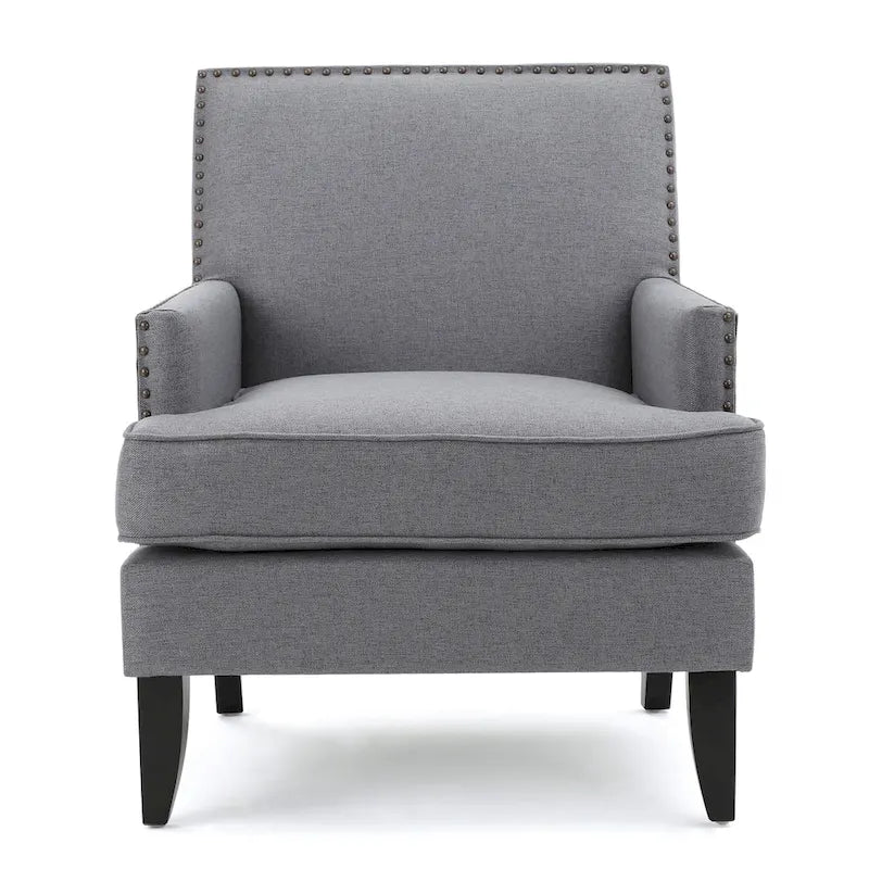 Fauteuil club en tissu clouté