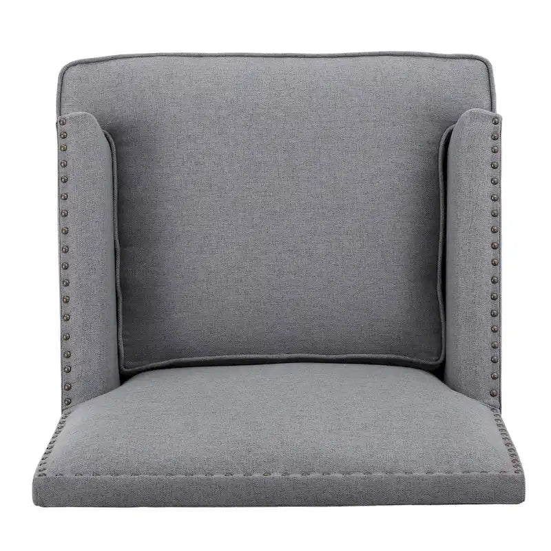 Fauteuil club en tissu clouté