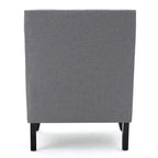 Fauteuil club en tissu clouté