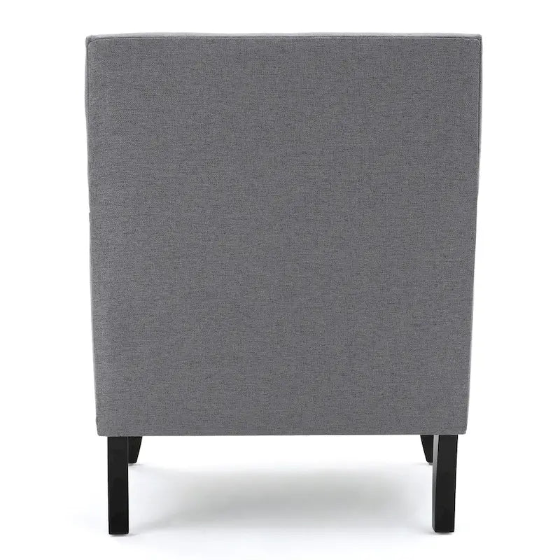 Fauteuil club en tissu clouté
