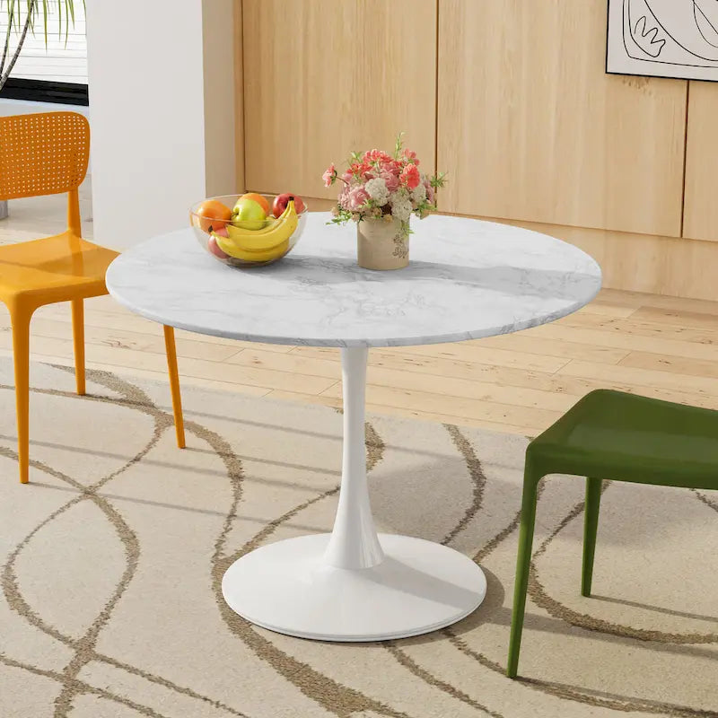 Table à manger moderne avec plateau rond et pied en métal