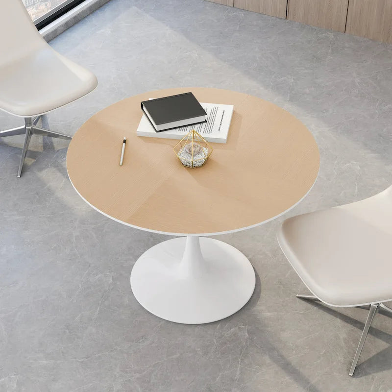 Table à manger moderne avec plateau rond et pied en métal