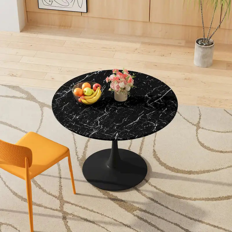 Table à manger moderne avec plateau rond et pied en métal