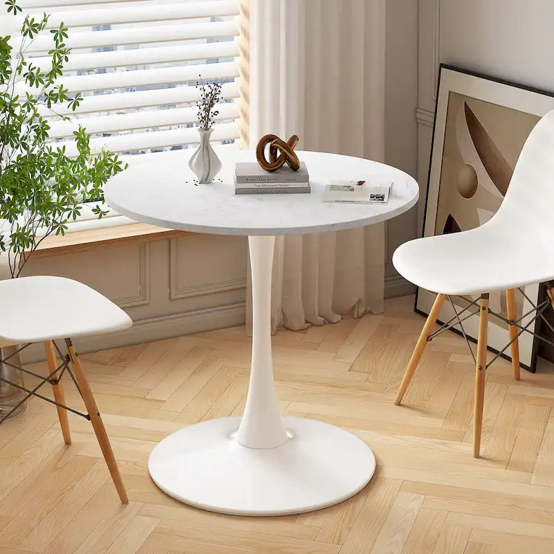 Table à manger moderne avec plateau rond et pied en métal