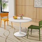 Table à manger moderne avec plateau rond et pied en métal