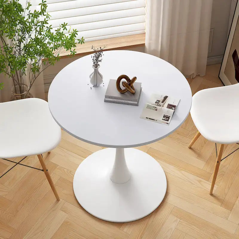 Table à manger moderne avec plateau rond et pied en métal