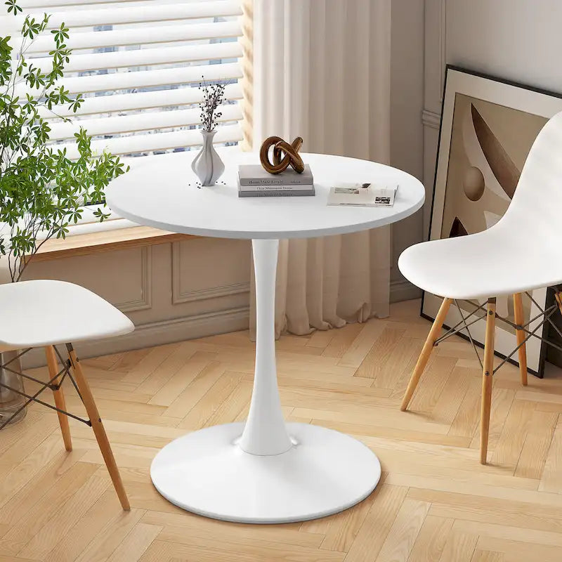 Table à manger moderne avec plateau rond et pied en métal